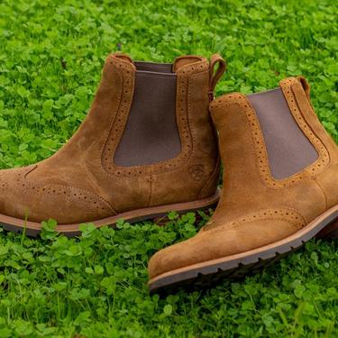 ariat waterproof booties laying on grass